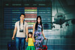 © Creativa Images - parents and child look at flight schedule for vacation. Interracial, adventure and people at airline