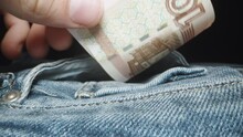 I Put A Hundred Ruble Banknote Into The Pocket Of The Jeans, Close-up.