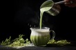 © primopiano - steamy milk being poured into matcha mixture