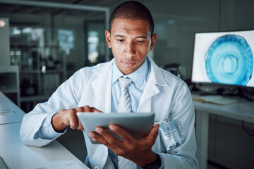 Man, night or tablet in science laboratory for medical research, deadline or pharmacy wellness. African scientist, person or working late on digital technology, DNA healthcare or genetic engineering