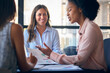© Monkey Business - Female Multi-Cultural Business Team Meet Around Boardroom Table With Laptops Discussing Documents
