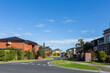 © Austockphoto - Road through brick buildings in housing area in outer city suburb of Springvale, Melbourne, Victoria