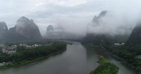 Wall Mural - Aerial photography of the natural scenery of the Li River in Xingping Ancient Town, Yangshuo County, Guilin, China on a cloudy and rainy day