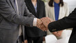 © PRPicturesProduction - closeup with cropped shot two businesspeople having handshake with both hands after negotiation. agreement and partnership concept
