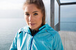 © Connect Images - Portrait of woman in sports clothing on pier