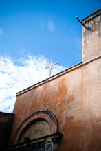 Italy, Rome, Church Facade With Cross Against Sky
