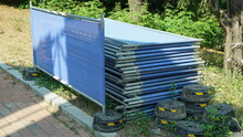 Stacked Blue Net Partition Barricades