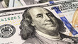 Close-up of Benjamin Franklin. One hundred US dollars. Cash banknotes. $100 bills. Background of cash dollar bills. Financial business background concept.