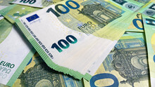 One Hundred Euros. The Single Currency Of The European Union. 100 Euro Bills. European Currency. Cash Banknotes. Financial Business Background Concept.