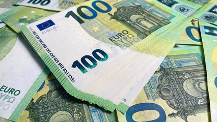 One hundred euros. The single currency of the European Union. 100 euro bills. European currency. Cash banknotes. Financial business background concept.