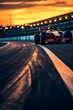 a blurry photo of a race track at sunset