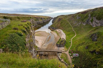 Wall Mural - Smoo Cave, near Durness in Scotland, a Popular Stop for Sightseeing on the NC500 Driving Route.