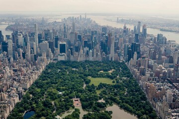 Poster - Aerial shot of the Central Park of New York city surrounded by urban skyscrapers