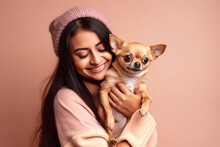 Young Happy Woman Holding Chihuahua Lap Dog In Front Of One Colored Studio Background.