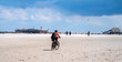 Cyclist on the beach of Sankt Peter Ording, North Sea, Germany