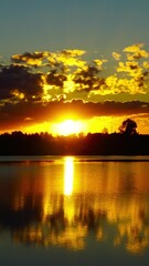 Wall Mural - landscape with sunrise over lake, timelapse. vertical video