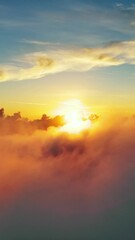 Wall Mural - flying above the clouds. aerial view of clouds and sunset sun. traveling by air perfect background. 