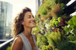 © Lais - Woman at urban farm in rooftop building in a city urban agriculture sustainability