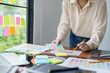 © Charlie's - Creative idea Business female Artist Creative Designer sketch graphic drawing on graphic tablet and Color swatch samples Concept of idea creativity.