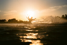 Kiteboarder Silhouette In Action In Epic Evening Sunset Scene, Red Sea.