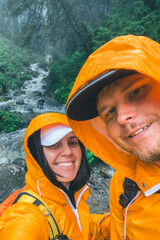 Canvas Print - happy couple hikers taking selfie river creek on background