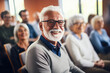 © Maria - Close-up portrait of senior gray-haired man sitting on business seminar looking at camera.