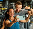 © Lumos sp - gym sport fitness exercise health woman training phone selfie coach trainer instructor personal photo portrait self posing camera healthy boyfriend girlfriend love