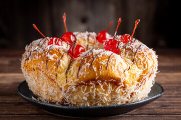 Wall Mural - Sweet bread with pastry cream, coconut and cherry.