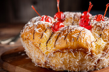 Poster - Sweet bread with pastry cream, coconut and cherry.