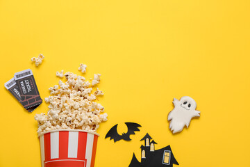 Sticker - Composition with tasty popcorn, cookie and cinema tickets on yellow background. Halloween celebration