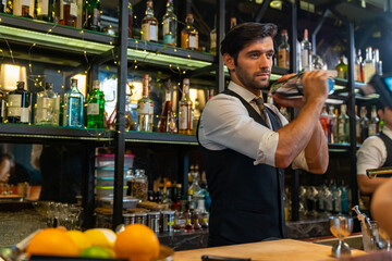 Poster - Professional Caucasian man bartender preparing and serving cocktail drink to customer on bar counter at nightclub. Barman making mixed alcoholic drink for celebrating holiday party at restaurant bar.