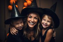 Three People Wearing Witch Hats And Hugging. The Hats Are Black And Pointed, Mother, Kids, Boy, Girl, Halloween