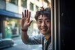 a photo portrait of a young happy smiling handsome guy waving with his hand out of the window and saying goodbye on a sunny day. Generative AI