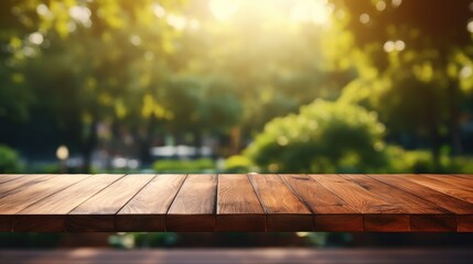 Wall Mural - Empty wooden table over blurred green nature park background, product display, Empty wood table and defocused bokeh and blur background of garden trees with sunlight. product display template.