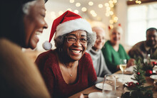Smiling Senior Black African American Dark-skinned Woman Celebrating Christmas With Her Family At The Holiday Table 