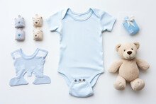 Cute Baby Clothes For Boy And Girl, Rattle, Bottle And Dummy Space In The Middle, On White Background Top View.