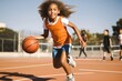 Pre-adolescent girl dribbling ball at sports court.