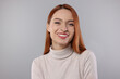 © New Africa - Portrait of beautiful young woman on light gray background