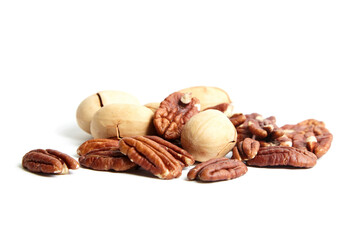 Wall Mural - Pecan nuts in shell and peeled pecan kernels isolated on white background. Velvety smoothness of the pecan kernel