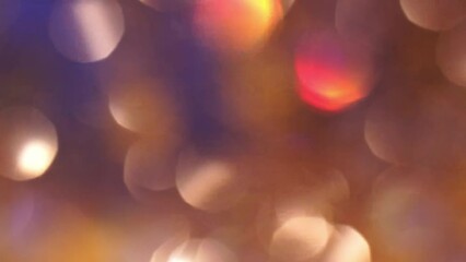 Wall Mural - Abstract background of shimmering gold bokeh on blue. Colorful Christmas bokeh background. Natural effect of blurry glitter.