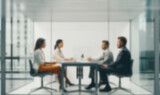 Fototapeta  - Diverse millennial business team talking in meeting room, negotiating on project at table at glass wall panoramic window, discussing deal in open space, modern office interior. blurred background 