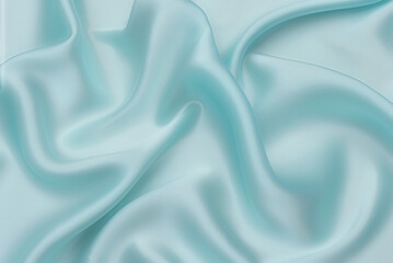 Wall Mural - Smooth elegant blue or tranquil silk or satin luxury fabric texture for using as abstract background