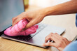 © JessicaLeigh J/peopleimages.com - Hands, wipe and laptop with dust, cleaning and hygiene with a cloth, washing or bacteria. Pc, person or worker with fabric, keyboard or covid compliance with technology, antibacterial or disinfection