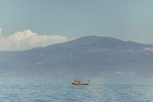 View Of A Small Fishing Boat Sailing Along The Sea Of Marmara, Mudanya, Bursa, Turkey.
