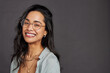 © Rido - Portrait of cheerful hispanic woman with eyeglasses smiling