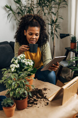 Wall Mural - A multiracial woman is enjoying her free time gardening.