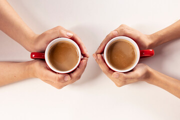 hands holding cup of tea, top view cup of tea, hands holding mug of tea 