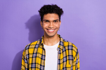 Sticker - Portrait of positive funny nice man with afro hairstyle wear plaid shirt toothy smiling at camera isolated on violet color background