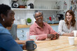 © ReeldealHD images - Group of multi generational women gathering socially with a hot drink