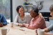 © ReeldealHD images - Senior african american woman sharing her story in a support group